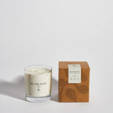 Boujie Be Present luxury soy wax jar candle, front view with packaging, displayed in a clear glass jar with box, scented with bay and rosemary.